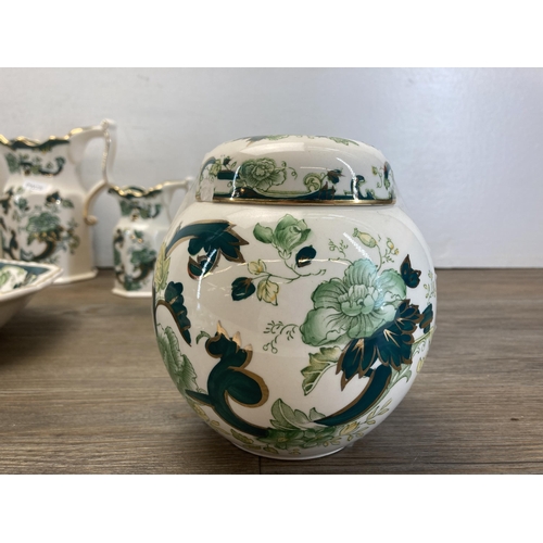 235 - A collection of Mason's Chartreuse ironstone pottery to include three graduating jugs, ginger jar an... 