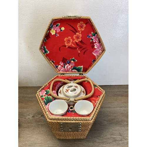 239 - A collection of Oriental items to include two resin figurines, cased Chinese miniature teaset, Chine... 