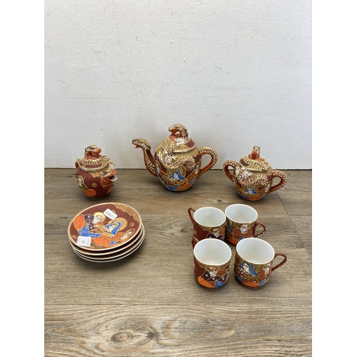 239 - A collection of Oriental items to include two resin figurines, cased Chinese miniature teaset, Chine... 