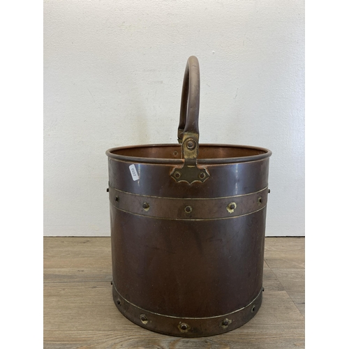 263 - A Victorian style copper and brass cylindrical coal bucket - approx. 32cm high x 32cm dimeter