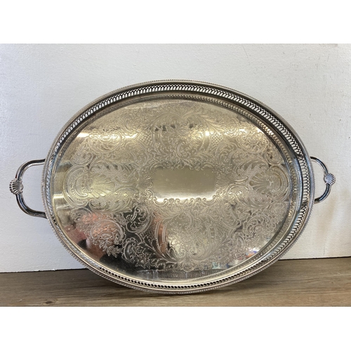 267 - Four silver plated galleried serving trays - largest approx. 54cm long x 36cm wide