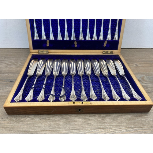 274 - A late 19th/early 20th century mahogany canteen of L & W S silver plated fish serving cutlery