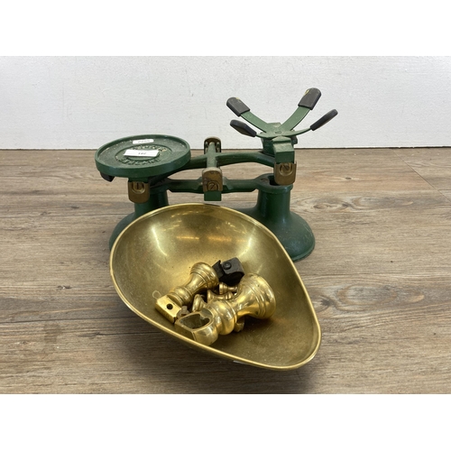 281 - A set of early 20th century Victor England green painted cast iron weighing scales with brass weight... 