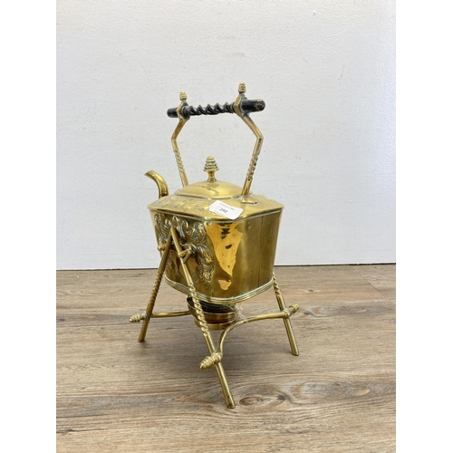 292 - An Arts and Crafts brass spirit kettle and stand - approx. 36cm high including stand