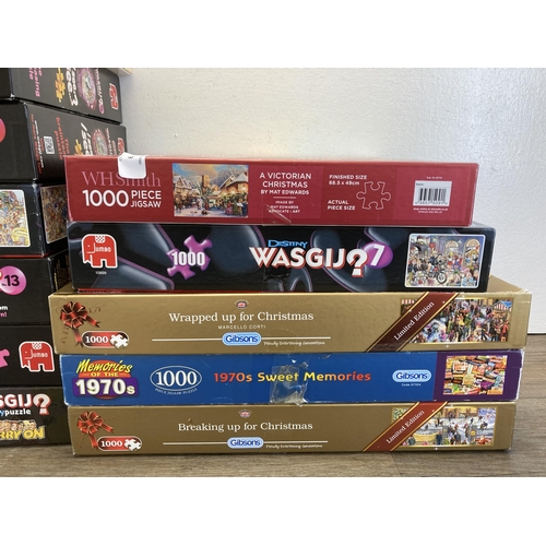 299 - Sixteen boxed jigsaw puzzles