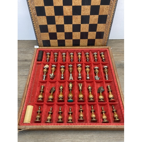 303 - A modern wood and metal chess set with leather board