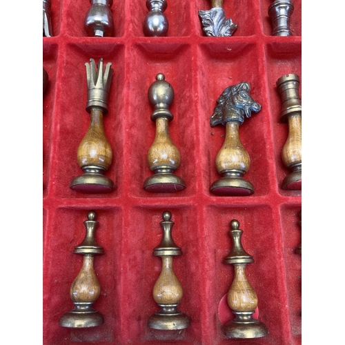 303 - A modern wood and metal chess set with leather board