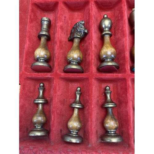 303 - A modern wood and metal chess set with leather board