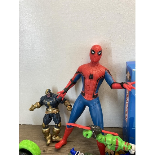 321 - A collection of toys and games to include Spider-Man figurine, Thanos figurine, boxed Doctor Who Fli... 