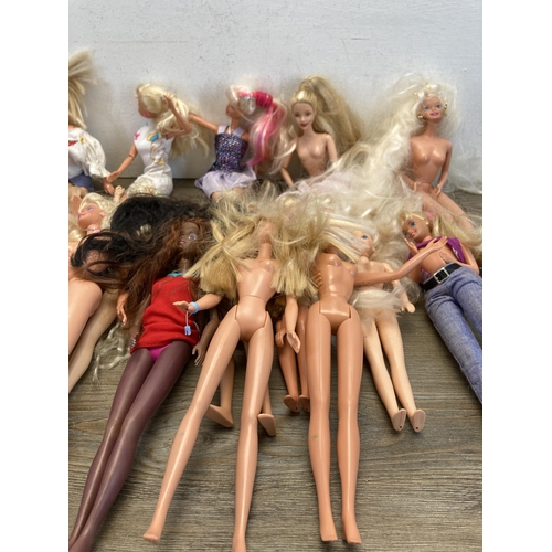 322 - A collection of Barbie dolls