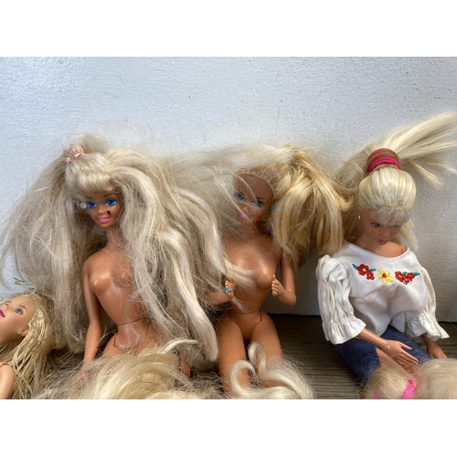 322 - A collection of Barbie dolls