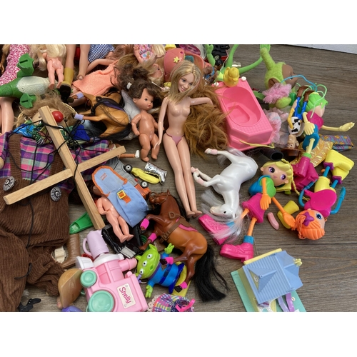 327 - A collection of soft toys and plastic dolls