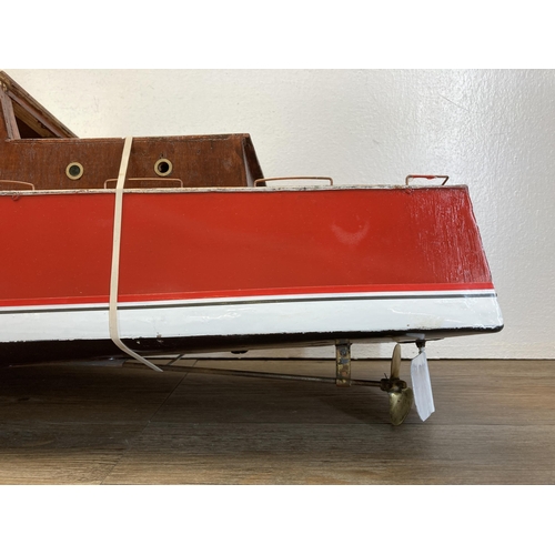 329 - A 1940s hand painted aluminium and wood model cabin cruiser - approx. 48cm high x 25cm wide x 112cm ... 