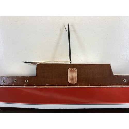 329 - A 1940s hand painted aluminium and wood model cabin cruiser - approx. 48cm high x 25cm wide x 112cm ... 