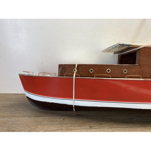 329 - A 1940s hand painted aluminium and wood model cabin cruiser - approx. 48cm high x 25cm wide x 112cm ... 