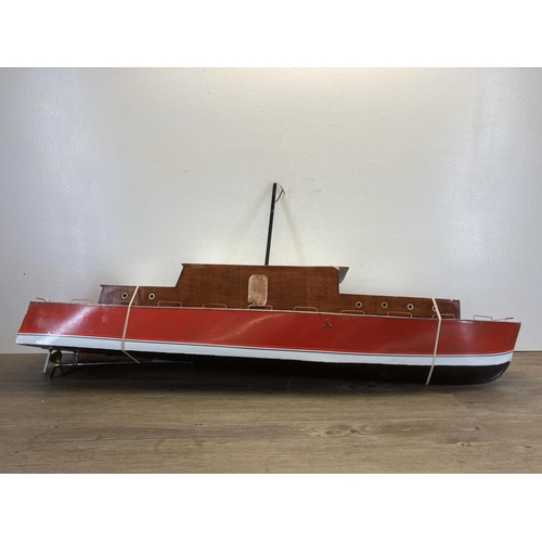 329 - A 1940s hand painted aluminium and wood model cabin cruiser - approx. 48cm high x 25cm wide x 112cm ... 