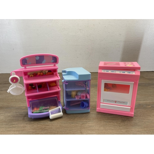 332 - A collection of Barbie doll furniture and accessories together with a Sindy fridge