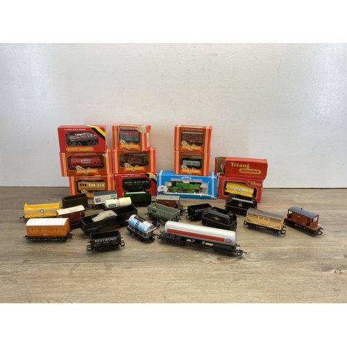 348 - A collection of Hornby OO gauge model railway accessories to include boxed R296 track cleaning coach... 