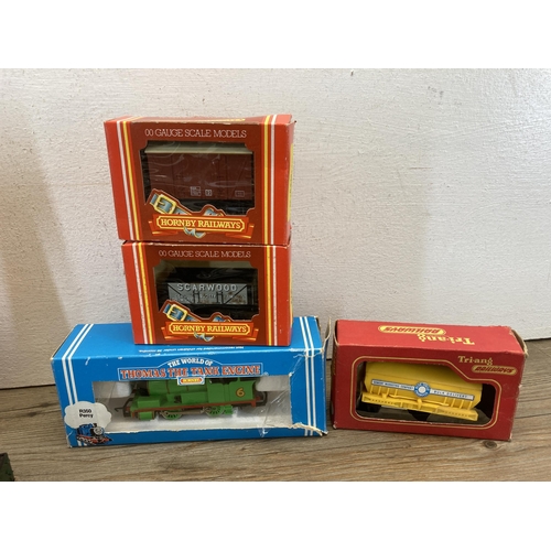 348 - A collection of Hornby OO gauge model railway accessories to include boxed R296 track cleaning coach... 