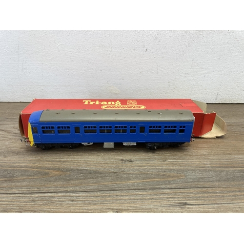 349 - Four boxed Tri-ang 'OO' gauge coaches and locomotives