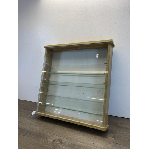 359 - A modern oak effect wall mountable display case - approx. 55cm high x 55cm wide x 10cm deep