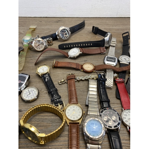 403 - A large collection of wristwatches to include Adec quartz alarm chronograph, Swatch quartz, Accurist... 