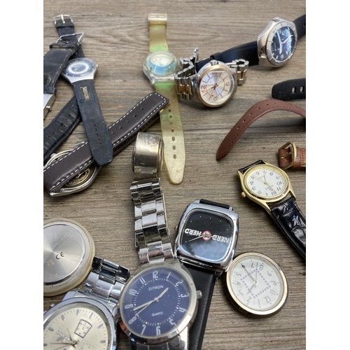 403 - A large collection of wristwatches to include Adec quartz alarm chronograph, Swatch quartz, Accurist... 