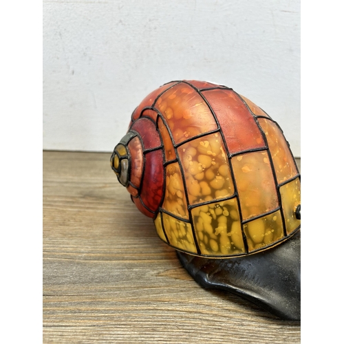 496 - A Tiffany style snail table lamp - approx. 13cm high x 25cm long