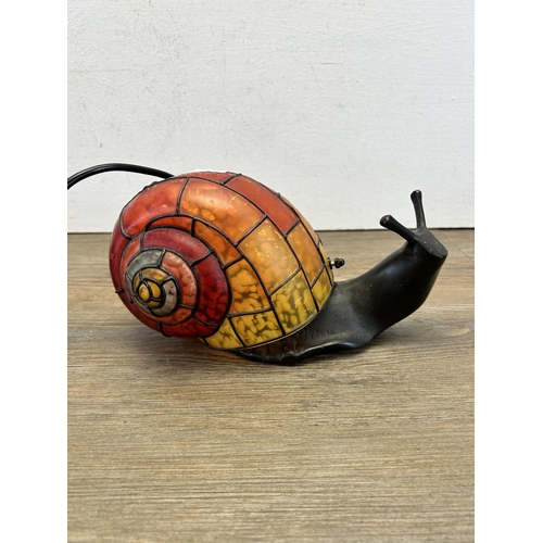 496 - A Tiffany style snail table lamp - approx. 13cm high x 25cm long