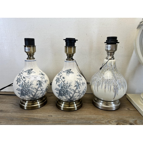 502 - Four modern table lamps, three Tara and one Coach House