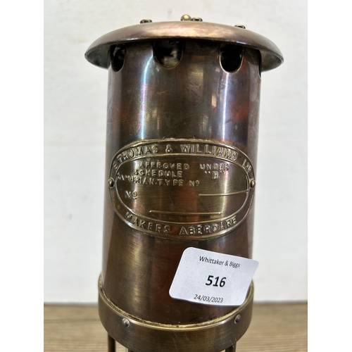 516 - An E. Thomas & Williams Ltd brass miner's lamp - approx. 26cm high