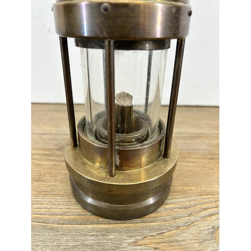 516 - An E. Thomas & Williams Ltd brass miner's lamp - approx. 26cm high