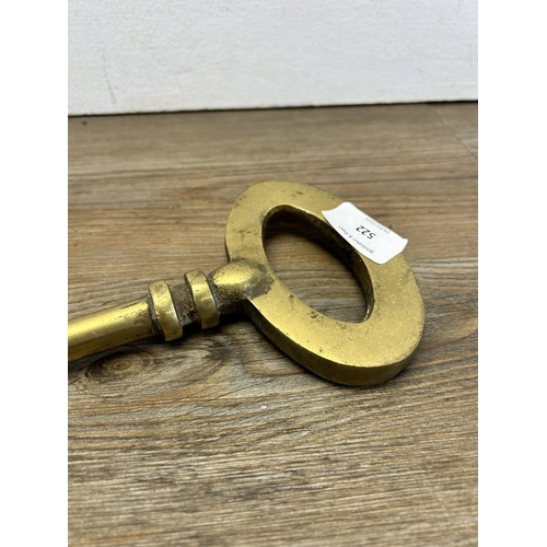 522 - A 19th century style oversized brass key - approx. 35cm long