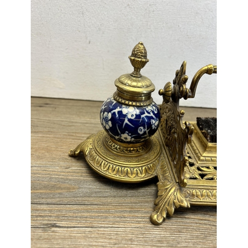 523 - A mid 20th century brass and ceramic inkwell - approx. 13cm high x 33cm wide x 15cm deep