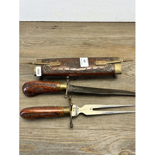 529 - An Indian hardwood and brass two piece carving set