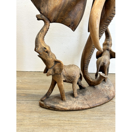 532 - An African carved teak elephant sculpture - approx. 42cm high x 32cm wide