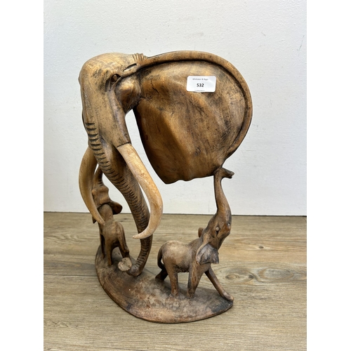 532 - An African carved teak elephant sculpture - approx. 42cm high x 32cm wide