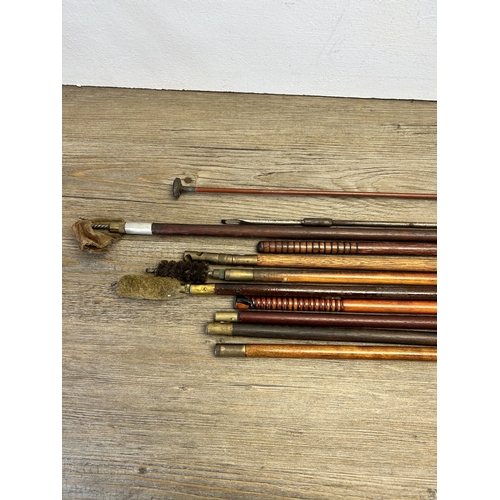 554 - Eleven vintage gun cleaning rods together with a WWII German K98 cleaning kit