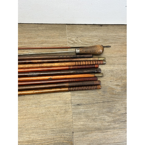 554 - Eleven vintage gun cleaning rods together with a WWII German K98 cleaning kit