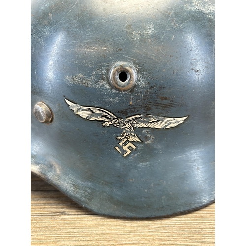 557 - A WWII German Luftwaffe M40 military helmet