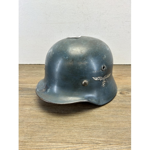 557 - A WWII German Luftwaffe M40 military helmet