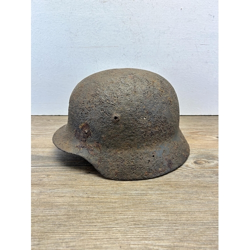 558 - A WWII German relic helmet