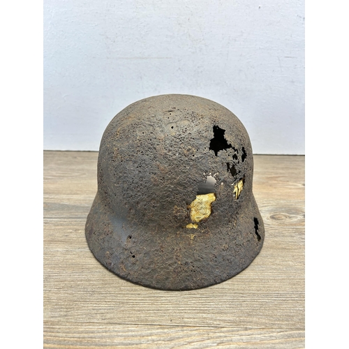 558 - A WWII German relic helmet