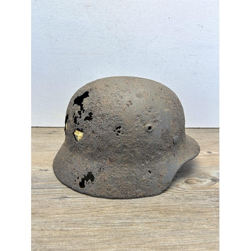 558 - A WWII German relic helmet