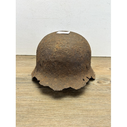 560 - A WWII German relic helmet