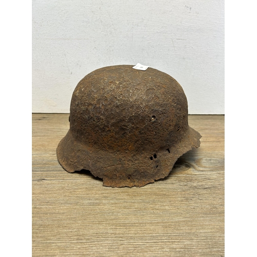 560 - A WWII German relic helmet