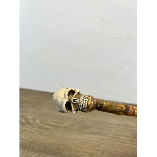 562 - A 19th century style memento mori walking cane - approx. 92cm long