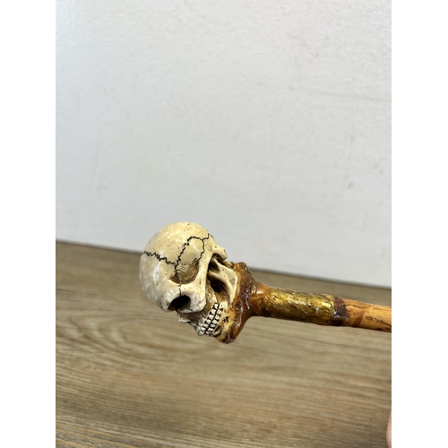 562 - A 19th century style memento mori walking cane - approx. 92cm long