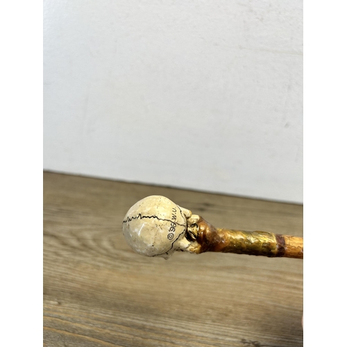 562 - A 19th century style memento mori walking cane - approx. 92cm long