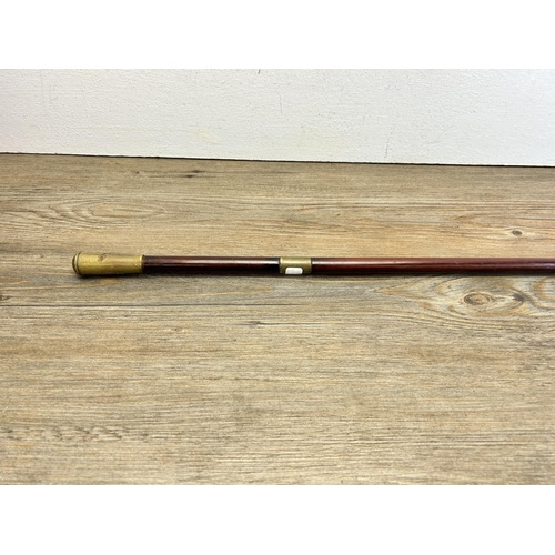 565 - A vintage SAS cane and brass swagger stick - approx. 92cm long